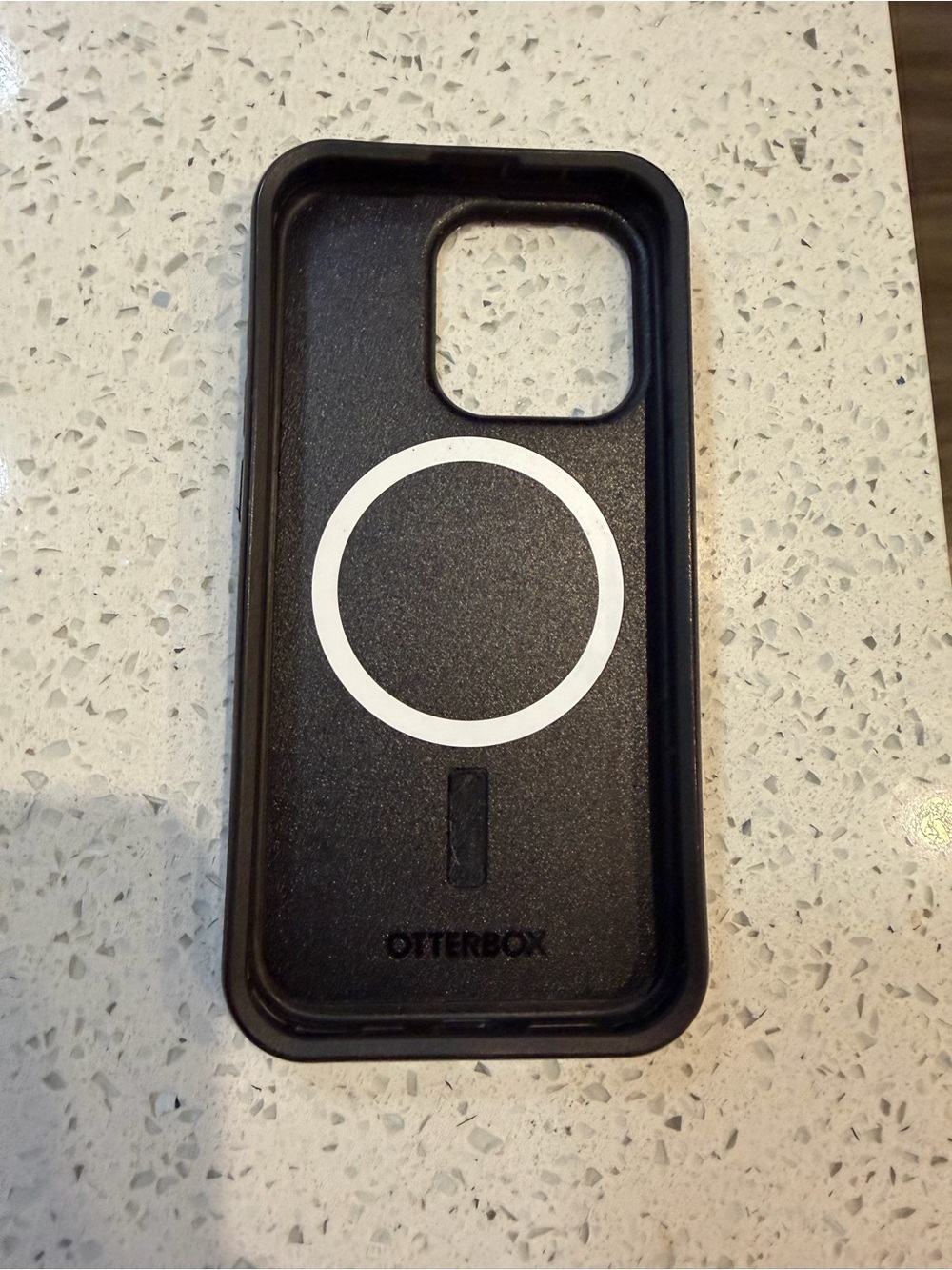 OtterBox Black Phone Case with White MagSafe Ring for iphone 15 pro.